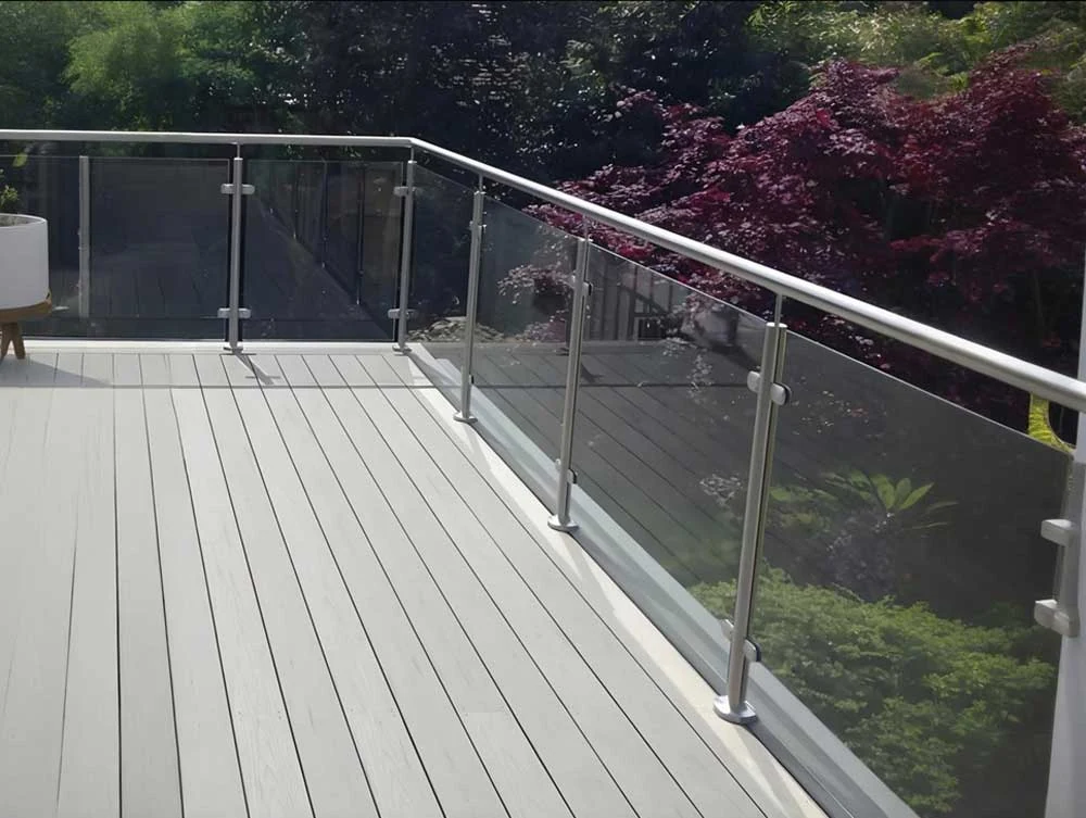 Glass balcony with stainless steel slot tube handrail
