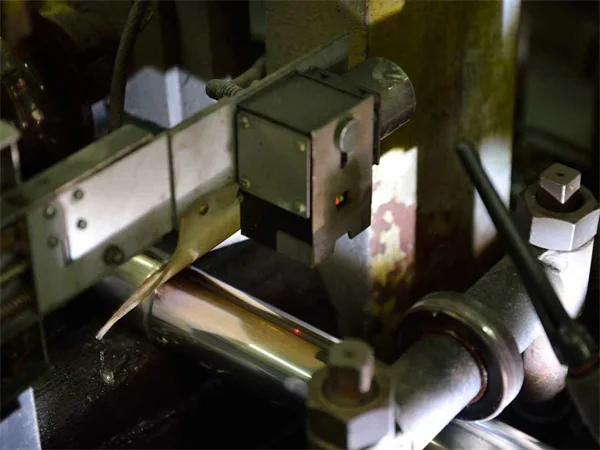 Stainless steel tube passing an in-process inspection station