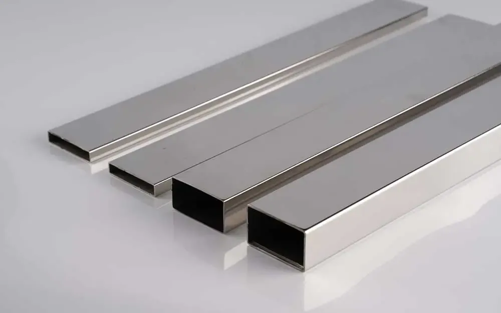 Brushed rectangular stainless steel tubes on a white background