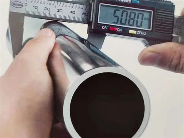 Stainless steel tube being checked for dimensional requirements